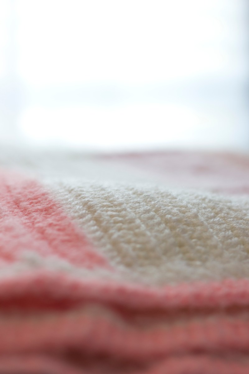 pink and white crochet blanket