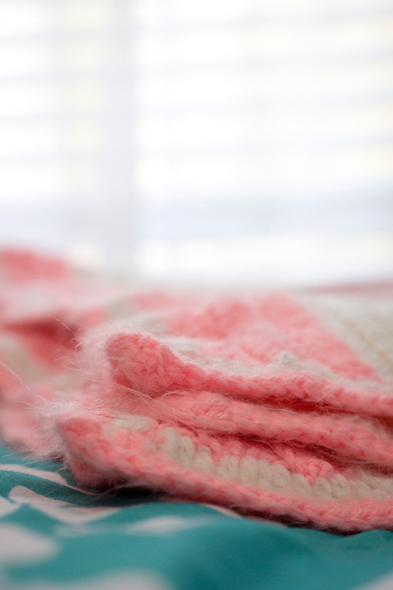 pink and white crochet blanket