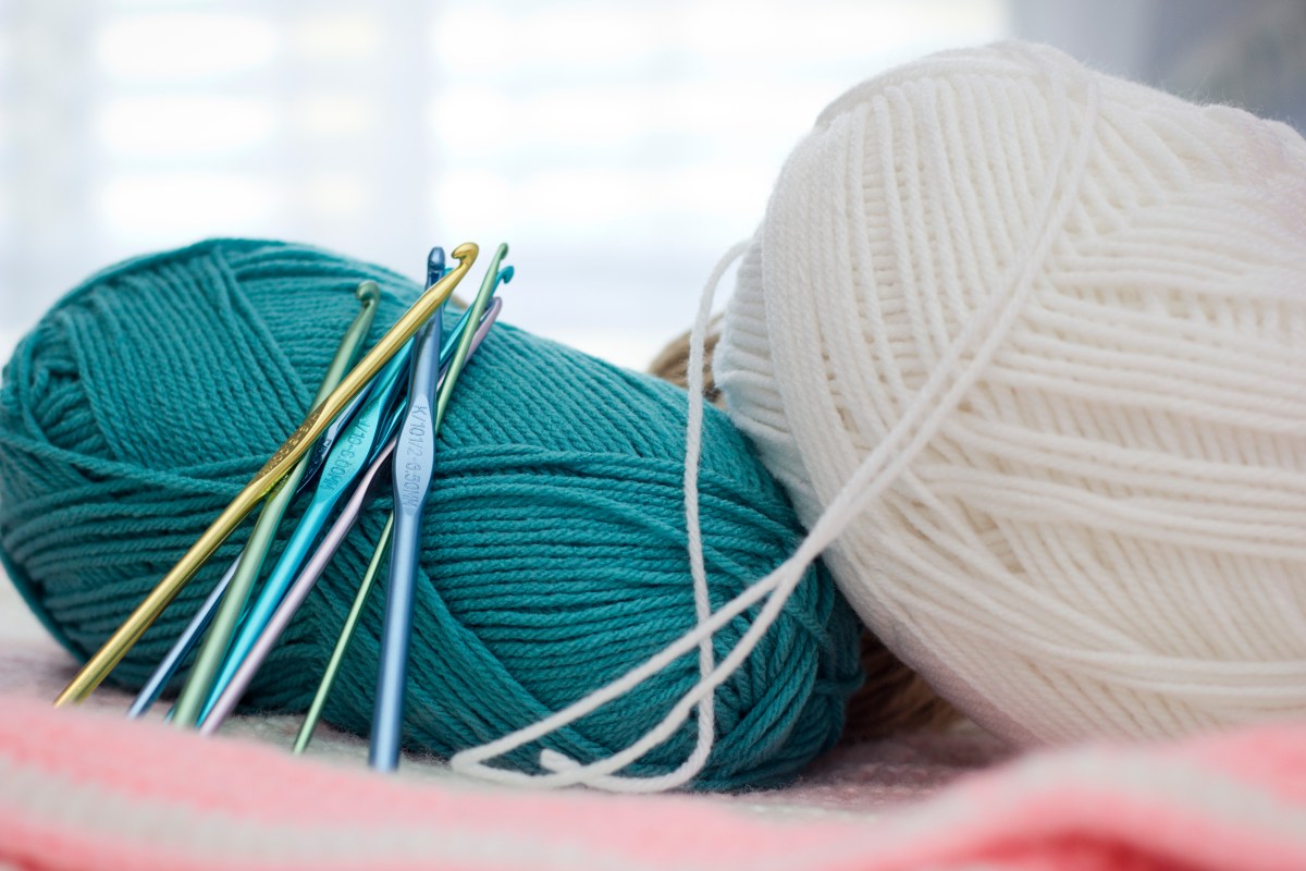 crochet tools and teal yarn